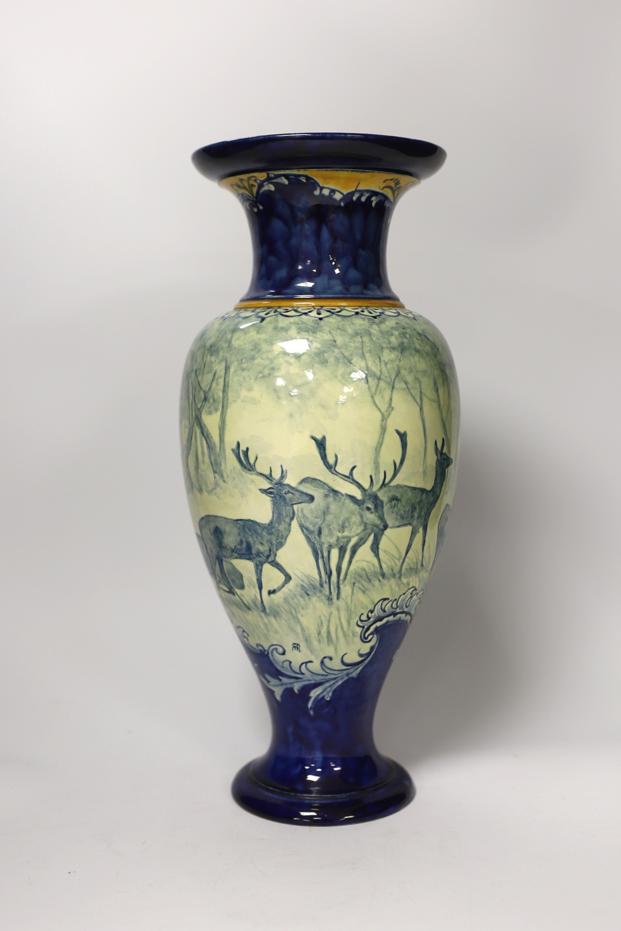 A Doulton Lambeth faience vase, c.1900, attributed to Hannah Barlow, painted with deer in woodland, monogram to the body, and to the base ‘KBS’ for Katherine B. Smallfield, 35cm, high, cf. Bonhams, Knightsbridge, London,